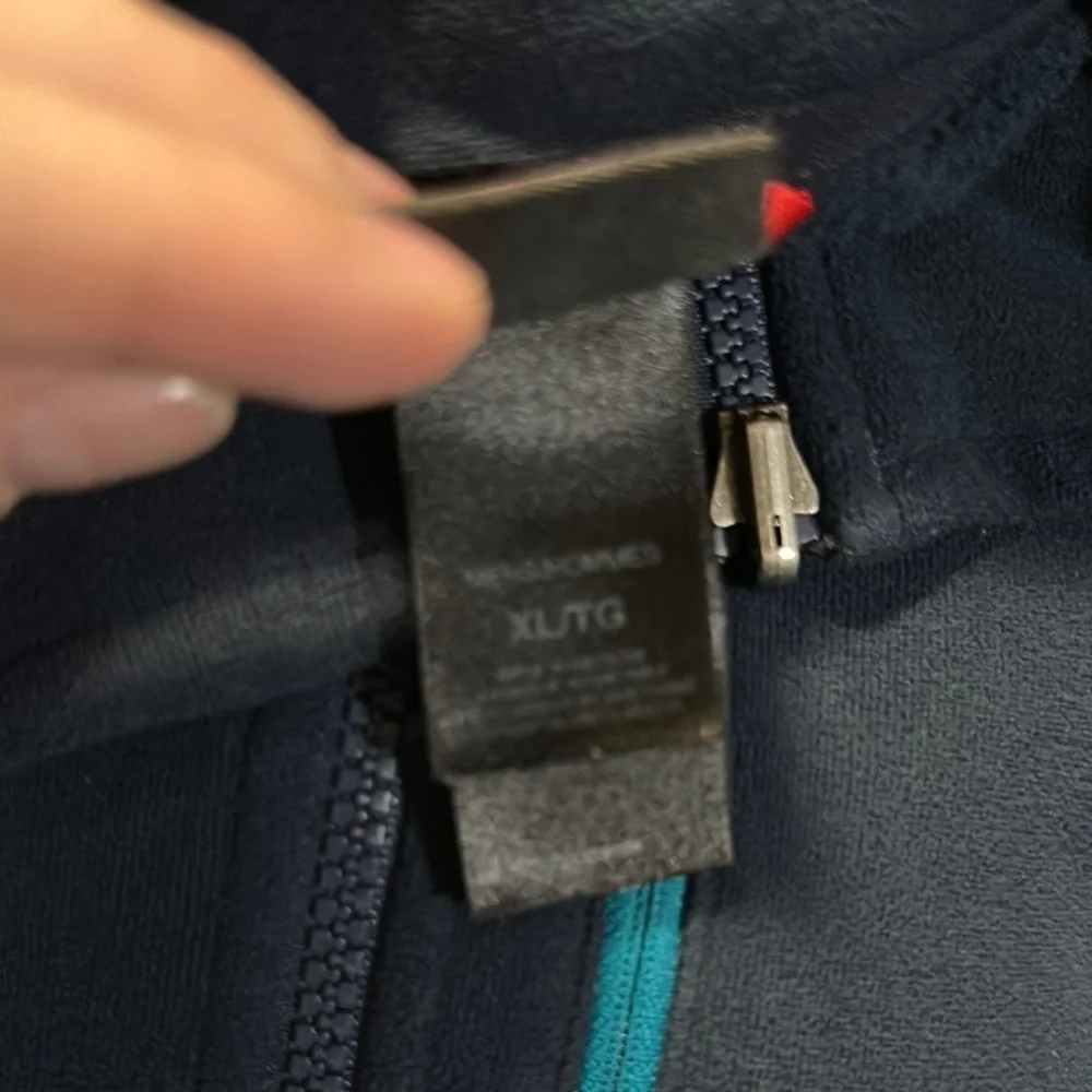 The North Face Navy Blue Fleece with Teal Accent Pocket and Dark Gray Side Panel
